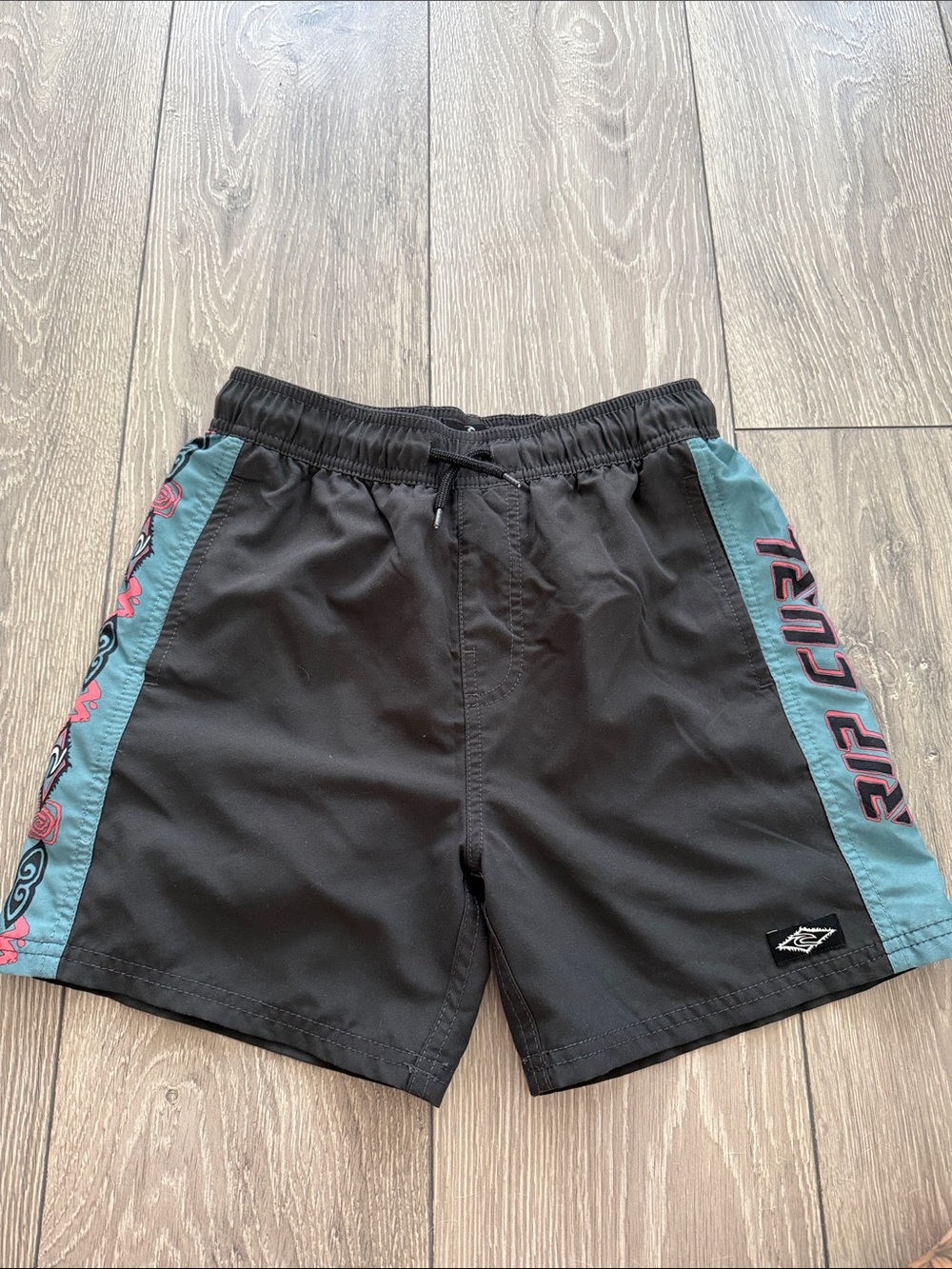 Rip Curl Black Swim Trunks with Teal Panels and Pink Logo